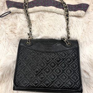 Tory Burch Fleming black embossed leather bag.